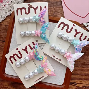 Detailed set of mermaid tail hair clips with pearls and sequins for young girls