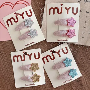 Detail of velvet star hair clips for girls in silver, pink, gold and blue glitter colors