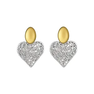 Two-tone heart-shaped hollow stud earrings with gold oval top and silver lattice design