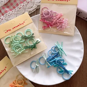 Colorful mini bow hair ties set for kids in pink, green and blue pastel shades