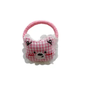 Cute pink plaid bear hair tie with lace trim and embroidered bear head details