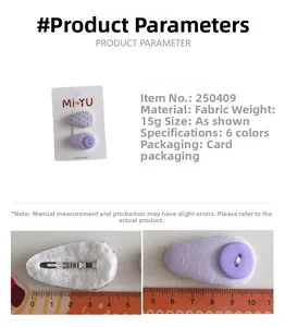 Detail view of purple fabric hair clips showing polka dot pattern and metal snap button back