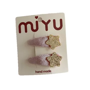 Pair of sweet pink velvet hair clips with gold sequin stars for girls and kids