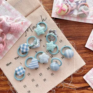 Mini élastiques pour filles avec motifs fleurs et carreaux en bleu pastel doux