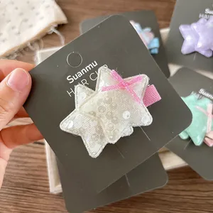 Pince à cheveux étoile avec paillettes colorées et ruban rose pour petites filles
