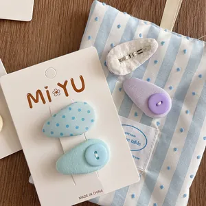 Set of sweet fabric BB hair clips with polka dots and buttons on brand display card