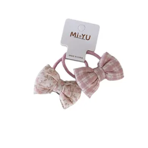 Pink floral and plaid bow hair ties set for girls on a white display card
