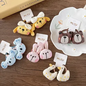 Detail of cute 3D embroidered animal hair ties including rabbit and bear for girls