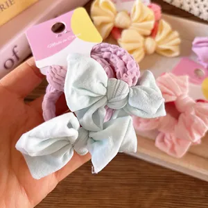Chouchous élastiques avec nœud aux couleurs pastel pour coiffure en queue de cheval