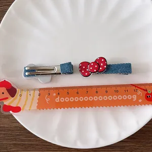 Cute denim blue and red polka dot bow hair clips for kids with size reference