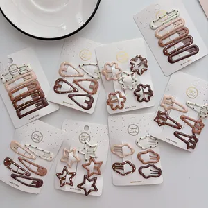 Detail of earthy-tone gradient polka dot hair clips set on handmade display cards