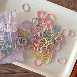 Macro detail of colorful seamless high-elastic hair ties in a portable resealable bag