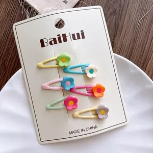 Set of six colorful candy-colored floral BB hair clips displayed on a white branded card