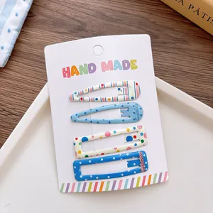 Set of 4 blue and beige polka dot drop-shaped and rectangular handmade hair clips