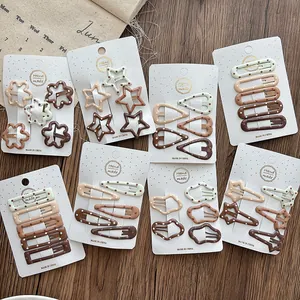 Detail of coffee-colored gradient hair clips with polka dots on handmade card