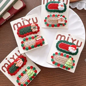 Detail showing eight handmade knitted Christmas hair clips with festive 3D ornaments