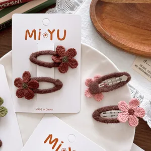 Cute crochet flower BB hair clips for girls in brown and pink on white display card