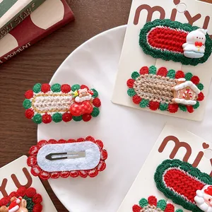 Cute knitted Christmas hair clips for girls featuring snowman and Santa Claus designs