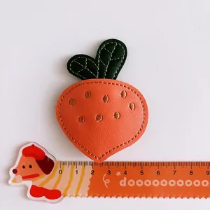 Cute carrot embroidered leather hair clip for girls with vibrant orange and green textures