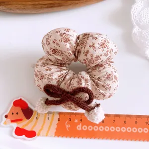 Floral milk coffee plaid scrunchie with dark brown bow and plush pompons for girls