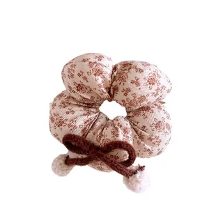 Floral plaid hair scrunchie with brown knit bow and white plush pom poms for girls