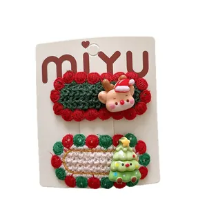 Handmade knitted Christmas hair clips set with cute reindeer and festive tree motifs