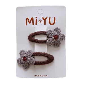 Set of two brown velvet BB hair clips with handmade lavender knit flower decorations