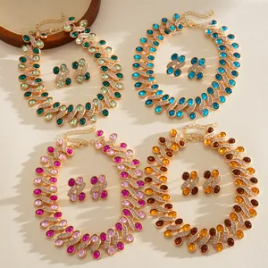 Retro court style resin and rhinestone necklace and earrings set in four vibrant colors.