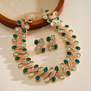 Close-up of vintage green resin jewelry set with gold-tone finish and crystal accents