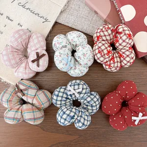 Set of six floral fabric hair ties with checkered and polka dot patterns for girls