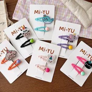 Close-up of embroidered animal cartoon hair clips set for girls on display cards
