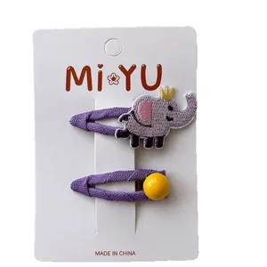 Kids purple embroidered elephant hair clips set with yellow bead on white display card
