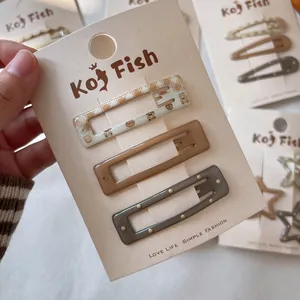 Three-piece hair clip set with cute bear patterns in brown and cream colors