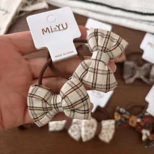 Set d'élastiques à cheveux avec nœuds en tissu à carreaux beige et marron