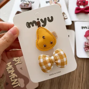 Handmade yellow pear and plaid bow hair clips set for girls on display card