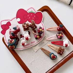 Detailed set of cute resin hair clips and ties with bunny, bear, and cherry motifs