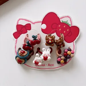 Set of 10 cute cartoon hair ties for girls featuring cherries, bears, and rabbits