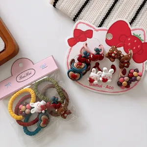 Detail of cute resin rabbit and bear hair ties set in colorful cartoon styles
