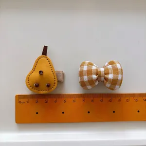 Cute yellow leather pear and gingham bow hair clip set for girls with sizing ruler