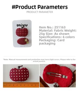 Détail de la taille de 5,5cm et du clip en métal des barrettes pommes rouges en tissu