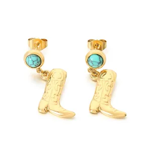 Trendy gold stainless steel cowboy boot dangle earrings featuring turquoise stones.
