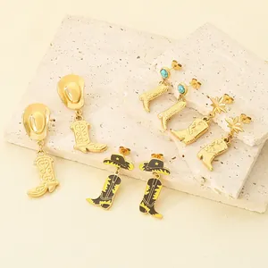 Detailed view of stainless steel cowboy boot and hat earrings with turquoise accents