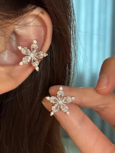 Macro detail of star flower ear cuff featuring brilliant white zirconia stones