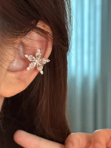 Detailed view of a sparkling cubic zirconia star ear cuff designed for non-pierced ears