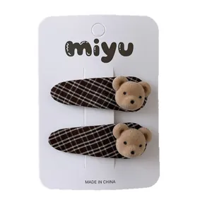 Set of two brown plaid hair clips with cute flocked teddy bear ornaments for girls