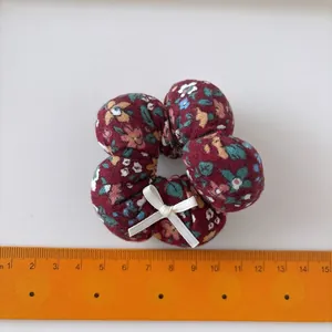Floral velvet hair scrunchie with red floral pattern and soft flower petal design for girls