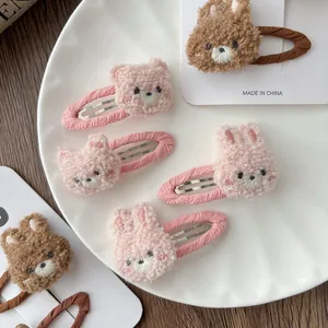 Cute plush bear and bunny hair clips for girls featuring soft embroidery and fabric lining