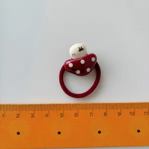 Cute red mushroom elastic hair tie for girls with polka dot resin charm and ruler reference