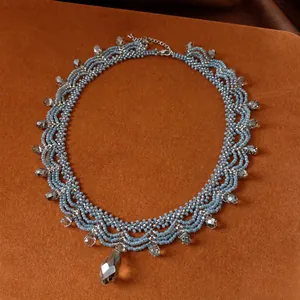 Vintage blue beaded lace necklace with a teardrop crystal pendant for vacation