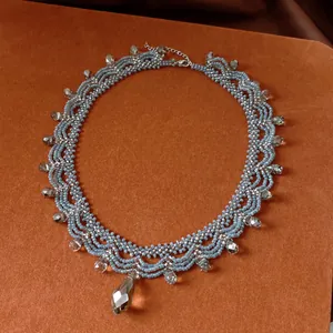 Vintage forest style beaded lace necklace featuring elegant faceted glass crystal drops on orange